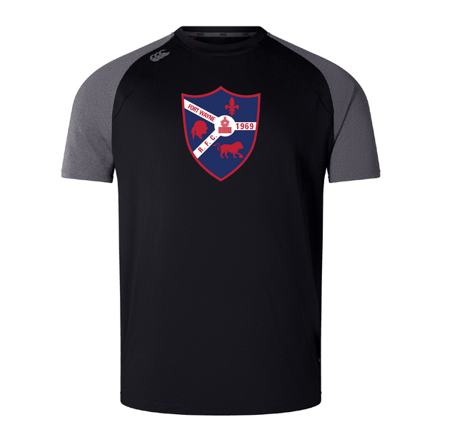 This black and gray tee from WRS Canterbury, inspired by the Fort Wayne Rugby Elite Training Tee, showcases a red and blue shield logo with a white diagonal band, fleur-de-lis emblem, and "Fort Worth R.F.C. 1969" text, crafted with Vapodri fabrics for lightweight comfort.