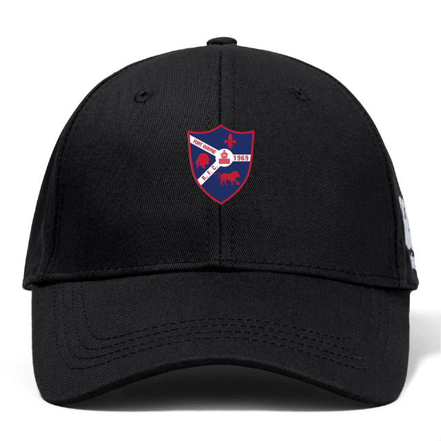 The Fort Wayne Rugby Flexfit Drill Cap by EMB Canterbury, in black, features an embroidered shield-shaped emblem with a bear, dinosaur, lighthouse, and the date 1959—combining style and nostalgia perfectly.