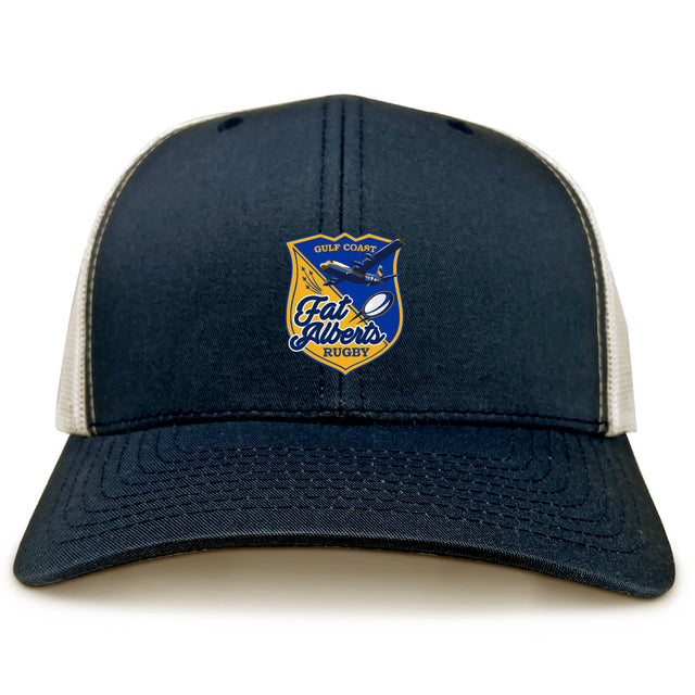 The Gulf Coast Fat Alberts Retro Trucker Cap by EMB S&S Activewear features a navy blue and beige design, an embroidered front logo patch, and a classic snapback closure.