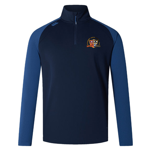 The Sacramento Rugby Football Club Women's Elite First Layer by EMB Canterbury is a navy and blue long-sleeve quarter-zip pullover with an embroidered crest on the left chest, logo on the right shoulder, and moisture-wicking fabric for comfort.