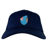 A Fiji Shield Flex Drill Cap by EMB Canterbury, in navy blue, showcases a shield logo with the Union Jack, a coat of arms, and the Fiji Shield.