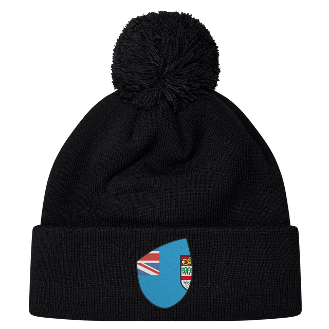 Cheer for Fiji with the Fiji Shield Pom Pom Beanie by EMB Canterbury. This stylish black beanie features a pom-pom and a blue emblem with a flag design, perfect for showcasing your rugby spirit and allegiance to the Fiji Shield.