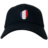 Introducing the France Shield Flex Drill Cap by EMB Canterbury, showcasing black fabric with a France shield design and vertical stripes in blue, white, and red.