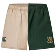 The Exiles Rugby Fundamental Harlequin Drill Short by EMB Canterbury features beige and dark green vertical panels, "CCC" and crest with "EXILES RFC" logos—ideal for rugby training or everyday comfort.