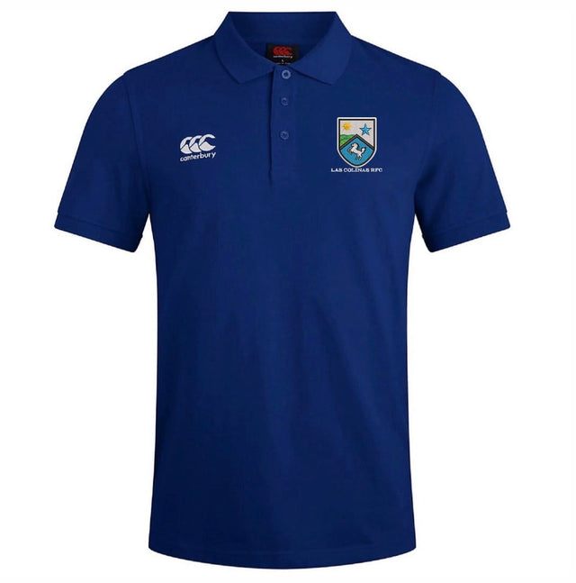 The Las Colinas Rugby Royal Waimak Polo by EMB Canterbury is a blue short-sleeved men's polo with a collar, featuring the Canterbury logo on the right chest and team crest on the left—perfect for rugby fans.