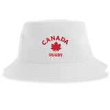 The Nations of Rugby Canada Rugby Sustainable Bucket Hat by EMB S&S Activewear is crafted from recycled polyester for an eco-friendly touch, featuring a white design with red "CANADA RUGBY" lettering and a maple leaf graphic on the front.