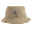 Show your support with the Nations of Rugby Scotland Rugby Sustainable Bucket Hat from EMB S&S Activewear. Made from recycled polyester for an eco-friendly choice, this beige hat features "Scotland Rugby" and a blue thistle emblem printed on the front.