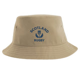 Show your support with the Nations of Rugby Scotland Rugby Sustainable Bucket Hat from EMB S&S Activewear. Made from recycled polyester for an eco-friendly choice, this beige hat features "Scotland Rugby" and a blue thistle emblem printed on the front.