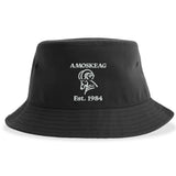 The Amoskeag Rugby Sustainable Bucket Hat by EMB S&S Activewear is a black, custom-made hat featuring "AMOSKEAG" text, a stylized ram logo, and "Est. 1984" embroidered in white on the front; this eco-friendly bucket hat is crafted with care and designed for lasting style.