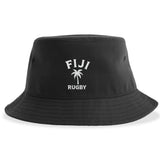 The EMB S&S Activewear Nations of Rugby Fiji Rugby Sustainable Bucket Hat is a black hat featuring “FIJI RUGBY” and a palm tree graphic embroidered in white on the front.
