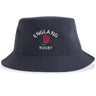 Show your support with the Nations of Rugby England Rugby Sustainable Bucket Hat by EMB S&S Activewear, featuring "ENGLAND RUGBY" text and an embroidered red rose emblem on the front. Crafted from recycled polyester, this eco-friendly bucket hat blends classic style with sustainable materials.