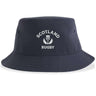 Check out the Nations of Rugby Scotland Rugby Sustainable Bucket Hat by EMB S&S Activewear, featuring "Scotland Rugby" and a thistle emblem printed in white on the front of a navy blue design. Made from recycled polyester, this bucket hat is a stylish and eco-friendly choice for any fan.