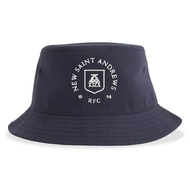 The New Saint Andrews College Sustainable Bucket Hat by EMB S&S Activewear is a navy blue hat featuring “New Saint Andrews RFC 1994” and a white emblem printed on the front.