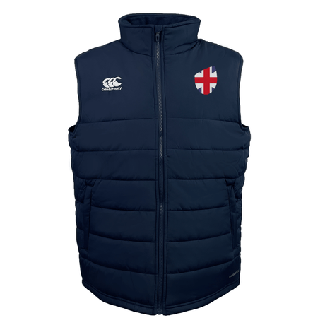 The Great Britain Shield Core Gilet by EMB Canterbury is a navy quilted vest with a white logo and England flag patch on the chest, featuring Thermoreg insulation for extra warmth.