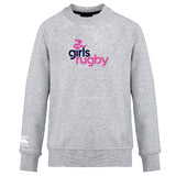 The Girls Rugby Club Crew Sweatshirt by WRS Canterbury is an ultra-soft light grey top with "girls rugby" in pink and navy, a rugby player icon above, and an embroidered CCC logo on the left sleeve.