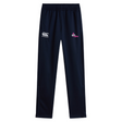 The Girls Rugby Stretch Tapered Pant by EMB Canterbury is navy blue with quick dry fabric, features an elastic waistband, a logo on the left thigh, and a "girls rugby" emblem on the right, providing comfort and style for every athletic endeavor.