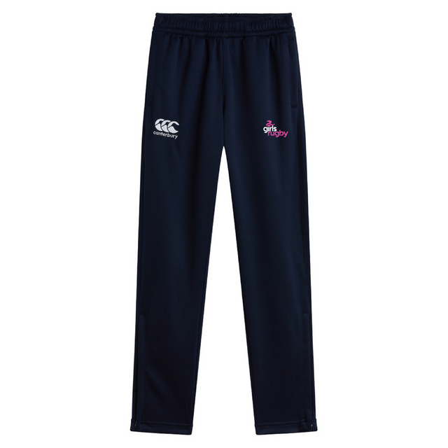 The Girls Rugby Stretch Tapered Pant by EMB Canterbury is navy blue with quick dry fabric, features an elastic waistband, a logo on the left thigh, and a "girls rugby" emblem on the right, providing comfort and style for every athletic endeavor.