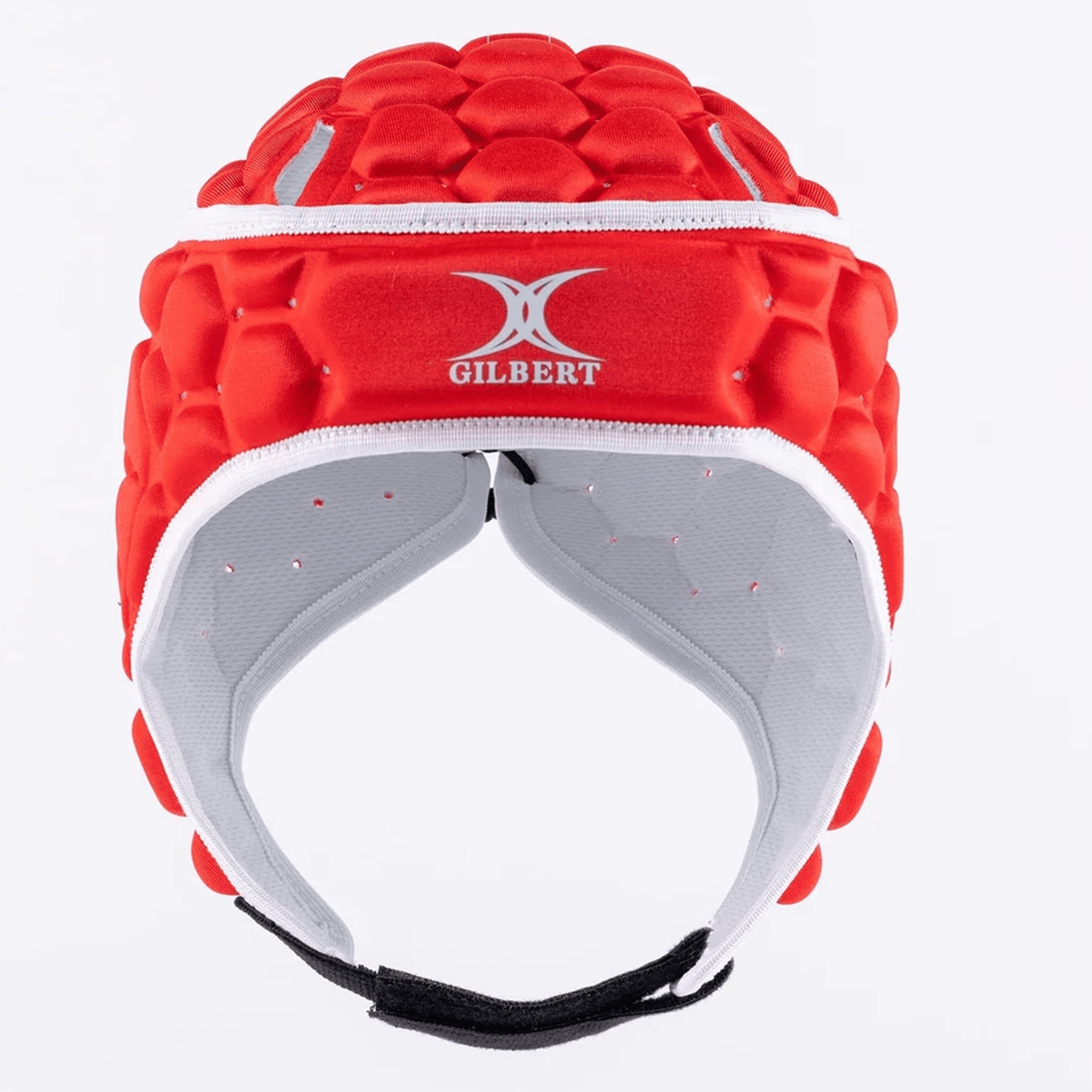 The XP 250 Rugby Headguard by Gilbert is a red headguard featuring a honeycomb pattern and hex padding for sports protection. It includes an adjustable strap and has a white interior.