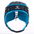 The XP 250 Rugby Headguard by Gilbert is a black and blue padded headguard that includes hex padding, a lace-up closure, ventilation holes, and is branded with the "Gilbert" logo.