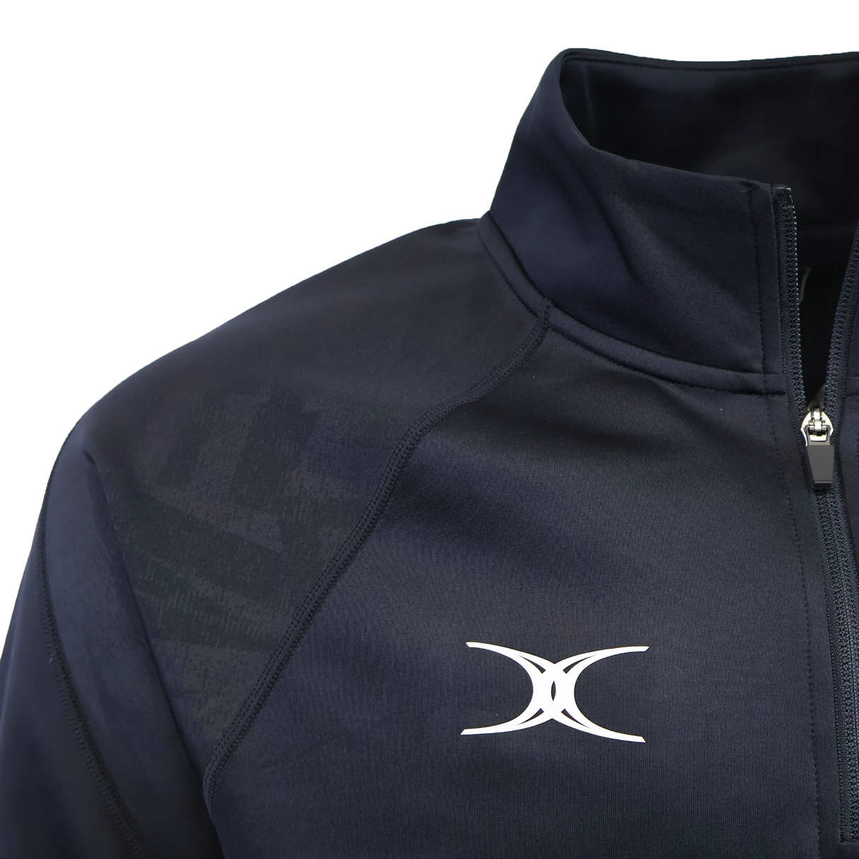 Close-up of the Gilbert GTS 1/4 Zip Poly Pullover, a dark navy rugby training top featuring a high collar, zipper, and Gilbert's white abstract logo on the chest.