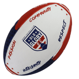 The Old Glory DC Supporter Ball by Gilbert is a white, red, and blue rugby ball with the team's logo and words "Passion," "Community," "Integrity," and "Respect"—perfect memorabilia for fans and collectors.