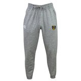 The Gotham Knights Leisure Sweatpant by Canterbury, from the brand EMB Canterbury, is crafted in gray recycled polyester and features an elastic waistband with a drawstring. It also displays a logo on the right leg and a small emblem on the left leg.