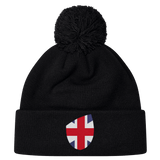The EMB Canterbury Great Britain Shield Pom Pom Beanie combines style and iconic pride with a black design featuring a Great Britain flag patch on the front.