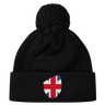 The EMB Canterbury Great Britain Shield Pom Pom Beanie combines style and iconic pride with a black design featuring a Great Britain flag patch on the front.