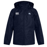The Holy Cross Club Vaposhield Stadium Jacket by EMB Canterbury features padded insulation, a navy blue design, white Canterbury and "HC" chest logos, a zippered front, and side pockets.