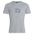 The Holy Cross Club Plain Tee by Canterbury from WRS Canterbury is a grey cotton blend short-sleeve shirt featuring a large blue "HC" logo with white and navy outline on the chest, offering customizable classic comfort and style.