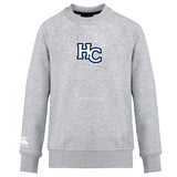 The Holy Cross Club Crew Sweatshirt by Canterbury is a light gray, ultra soft long-sleeve from WRS Canterbury, featuring a large navy and white "HC" logo on the chest and a small embroidered CCC logo on the left sleeve.