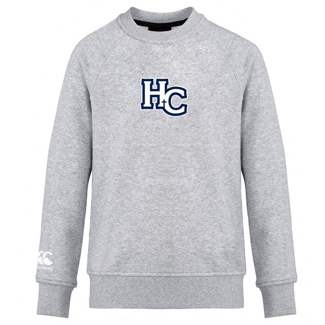 The Holy Cross Club Crew Sweatshirt by Canterbury is a light gray, ultra soft long-sleeve from WRS Canterbury, featuring a large navy and white "HC" logo on the chest and a small embroidered CCC logo on the left sleeve.