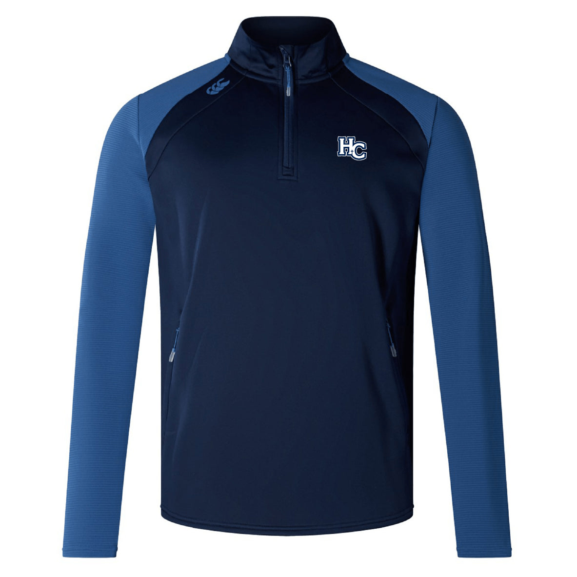 The Holy Cross Elite First Layer by EMB Canterbury is a navy and light blue long-sleeve quarter-zip top with the "HC" logo, side zip pockets, and VapoDri technology for advanced comfort.