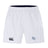 The EMB Canterbury Holy Cross Advantage Short 2.0 features white performance fabric, an elastic waistband, a black Canterbury logo on the left leg, and a blue and white "HC" logo on the right—ideal for athletes seeking comfort and style.