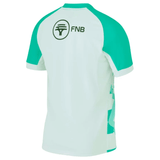 A green and white short-sleeved sports jersey viewed from the back, featuring the FNB logo on the upper back. This Nike Springboks Replica Away Jersey is just in.