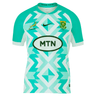 Just In: A green and white geometric-patterned **Springboks Replica Away Jersey by Nike** featuring the **Nike** logo, MTN sponsorship, a Springboks emblem, and the message "Stronger Forever" on the collar.