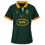 The Women's Springboks Replica Home Jersey by Nike is green and yellow, featuring the iconic "Springbok" logo and "MTN" sponsor. The Nike logo ensures style and authenticity, making it a perfect choice for women wanting to support the team.
