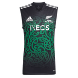 Support the team with the Maori All Blacks Performance Singlet by adidas, a black sleeveless jersey adorned with green Maori-inspired patterns. Featuring AEROREADY technology for maximum comfort, it showcases the adidas Rugby and INEOS logos along with "Maori All Blacks" text.