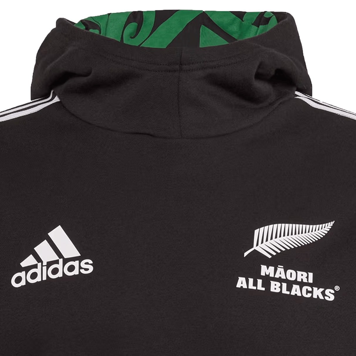 Close-up of the black Maori All Blacks Performance Hoodie by adidas, showcasing the iconic silver fern emblem on the chest.