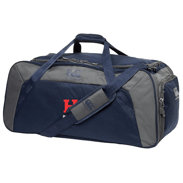 The Howard University Holdall Duffle Bag by EMB Canterbury, in navy and gray, features a shoulder strap and zippered compartments. Its sleek design with water-repellent material is perfect for storing rugby essentials.