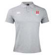 The Howard University Waimak Polo by Canterbury is a grey rugby polo crafted from a comfortable cotton-polyester blend, featuring an EMB Canterbury logo, red "H" emblem, and "Howard Hewett" text on the front.