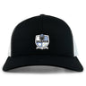 The Austin Huns Rugby Retro Trucker Cap by EMB S&S Activewear features a black-and-white design with the team crest, helmeted figure, shield, and "EST. 1972" embroidered on the front. Snapback closure provides a comfortable fit.
