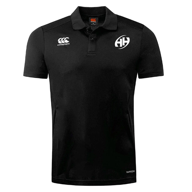 The Clarksville Headhunters Club Dry Polo by EMB Canterbury is a black short-sleeve polo with collar and button placket, featuring Vapodri Technology for moisture-wicking comfort and two chest logos: "Canterbury" and a circular "AH.