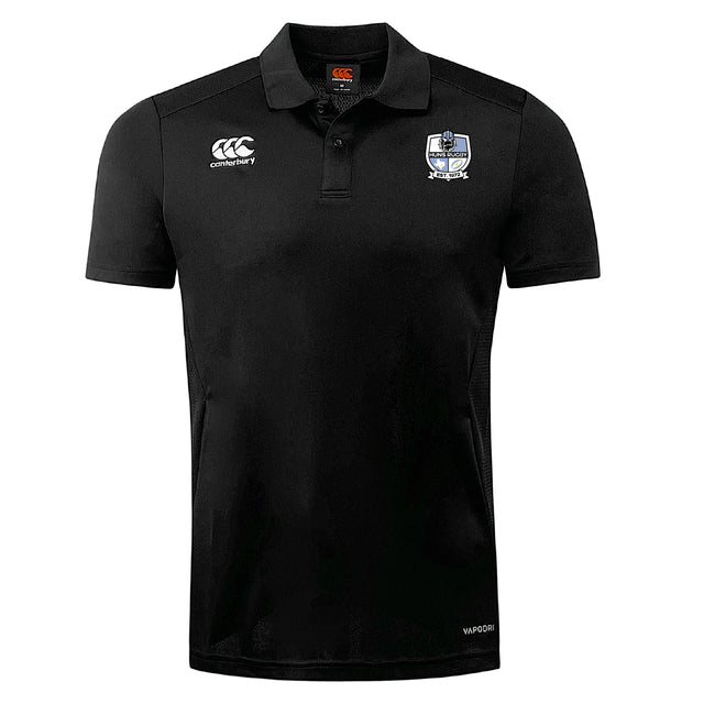 The Austin Huns Rugby Club Dry Polo by EMB Canterbury is a black short-sleeve shirt with a white embroidered club logo on the left chest and Canterbury logo on the right, made with breathable Vapodri technology for active wear.