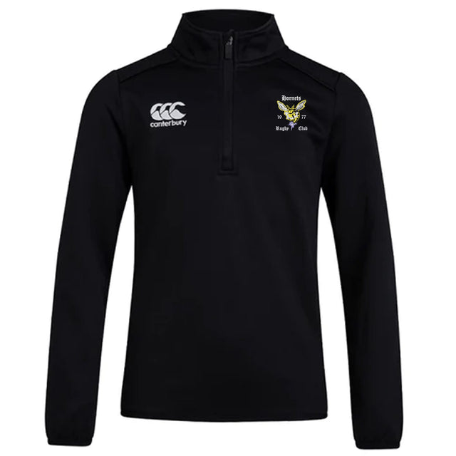 The Hornets Rugby Club Club 1/4 Zip Mid Layer Training Top by EMB Canterbury is a black long-sleeve top with the “Canterbury” logo on the right chest and a CCC Club crest with text on the left.