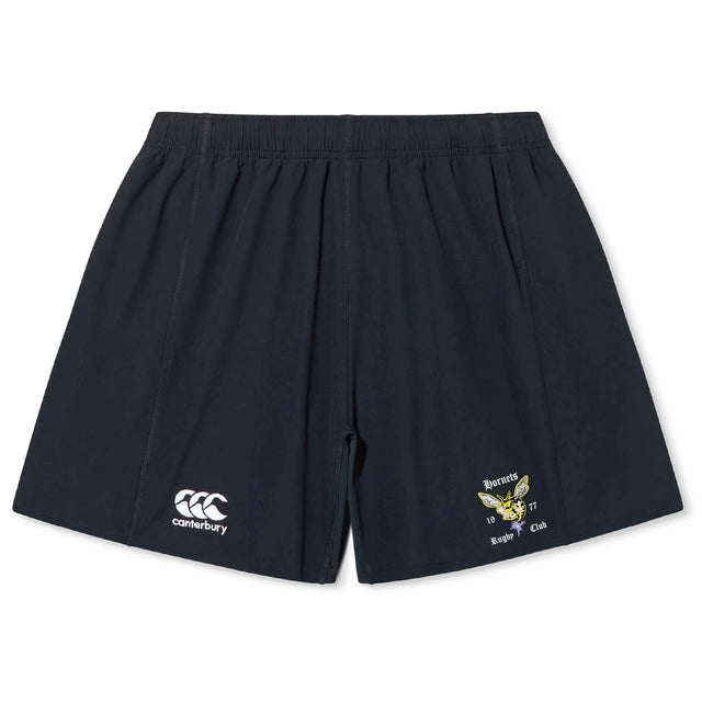The Hornets Rugby Club Yokohama Short by EMB Canterbury features navy blue fabric, an elastic waistband, a white Canterbury logo on the left leg, and a yellow Hornets Rugby Club emblem on the right leg.
