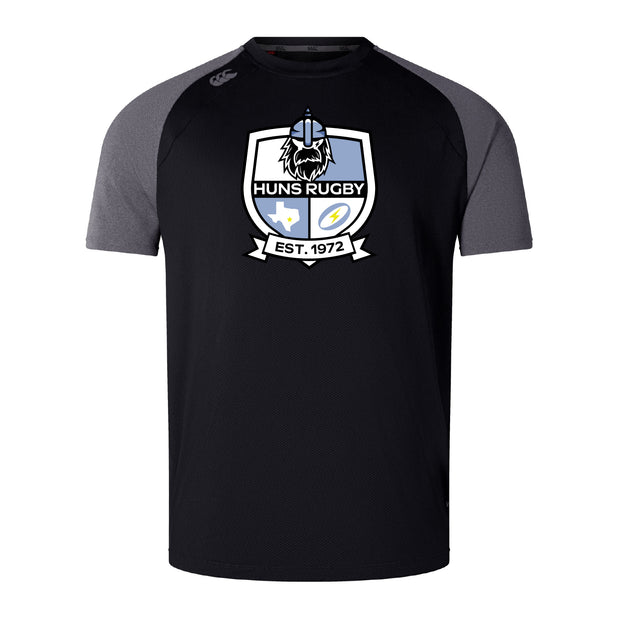 The Austin Huns Rugby Elite Training Tee by WRS Canterbury features black short sleeves, gray shoulders, a "Huns Rugby" team logo with "EST. 1972" on the front, and is made from lightweight Vapodri fabric for comfort and performance.