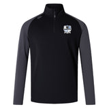 The Austin Huns Rugby Elite First Layer by EMB Canterbury is a black and dark grey long-sleeve quarter-zip pullover with VapoDri tech, crest logo on the left chest, and a small right shoulder logo—perfect as a rugby training top.
