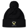 The Hornets Rugby Club Pom Pom Beanie by EMB Canterbury is a black fleece-lined knit hat with a pom-pom and embroidered "Hornets Rugby Club 1977" logo—perfect for rugby fans.
