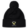 The Hornets Rugby Club Pom Pom Beanie by EMB Canterbury is a black fleece-lined knit hat with a pom-pom and embroidered "Hornets Rugby Club 1977" logo—perfect for rugby fans.